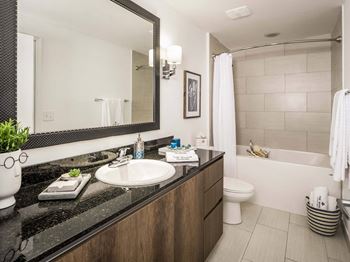 Large Soaking Tub In Master Bathroom With A Tile Surround at The Manor at CityPlace, Doral, FL